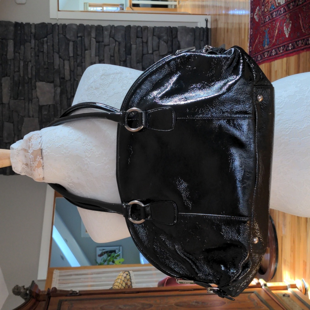 Patent leather handbag with matching boots.